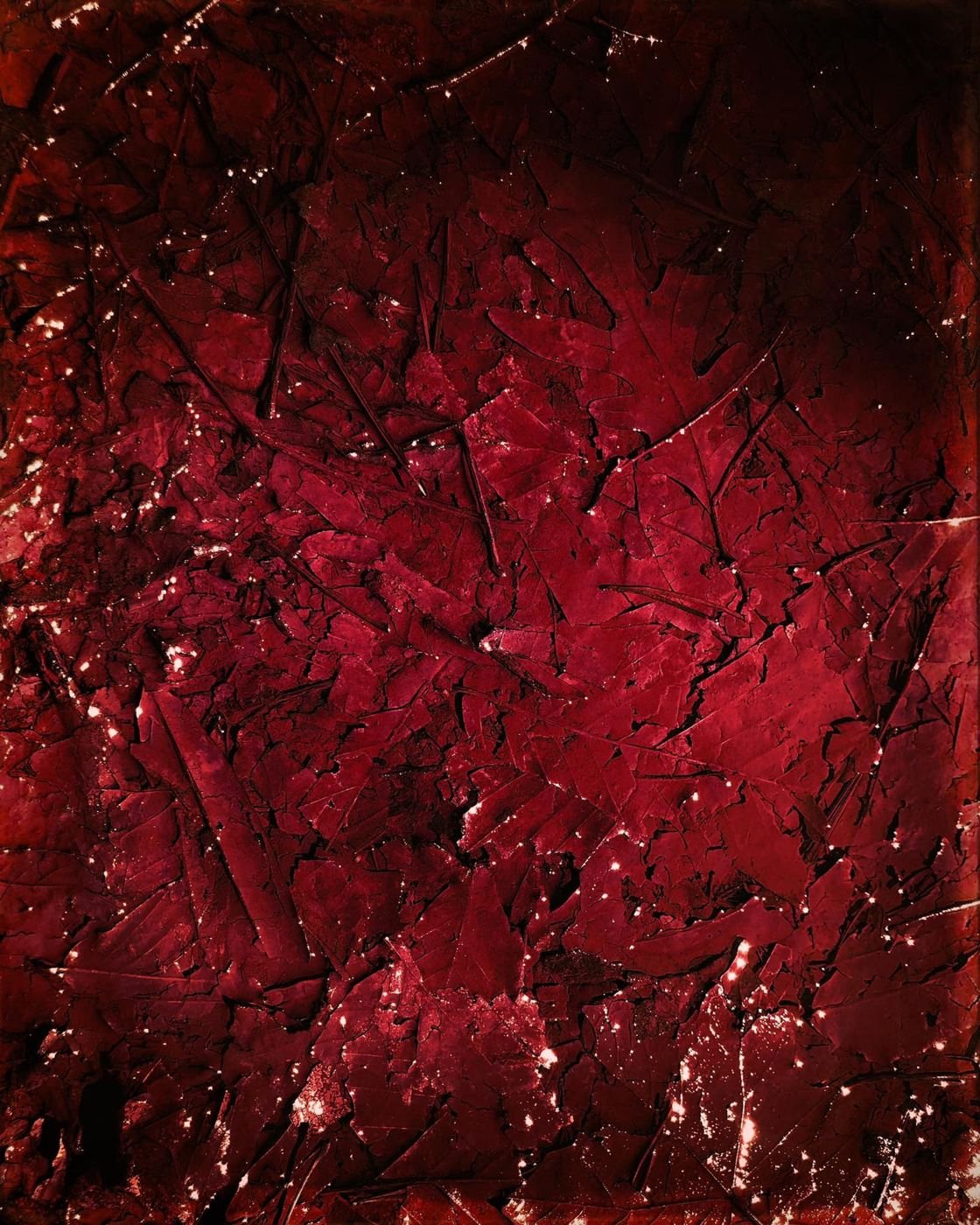 Deep red, crazed like old lacquer